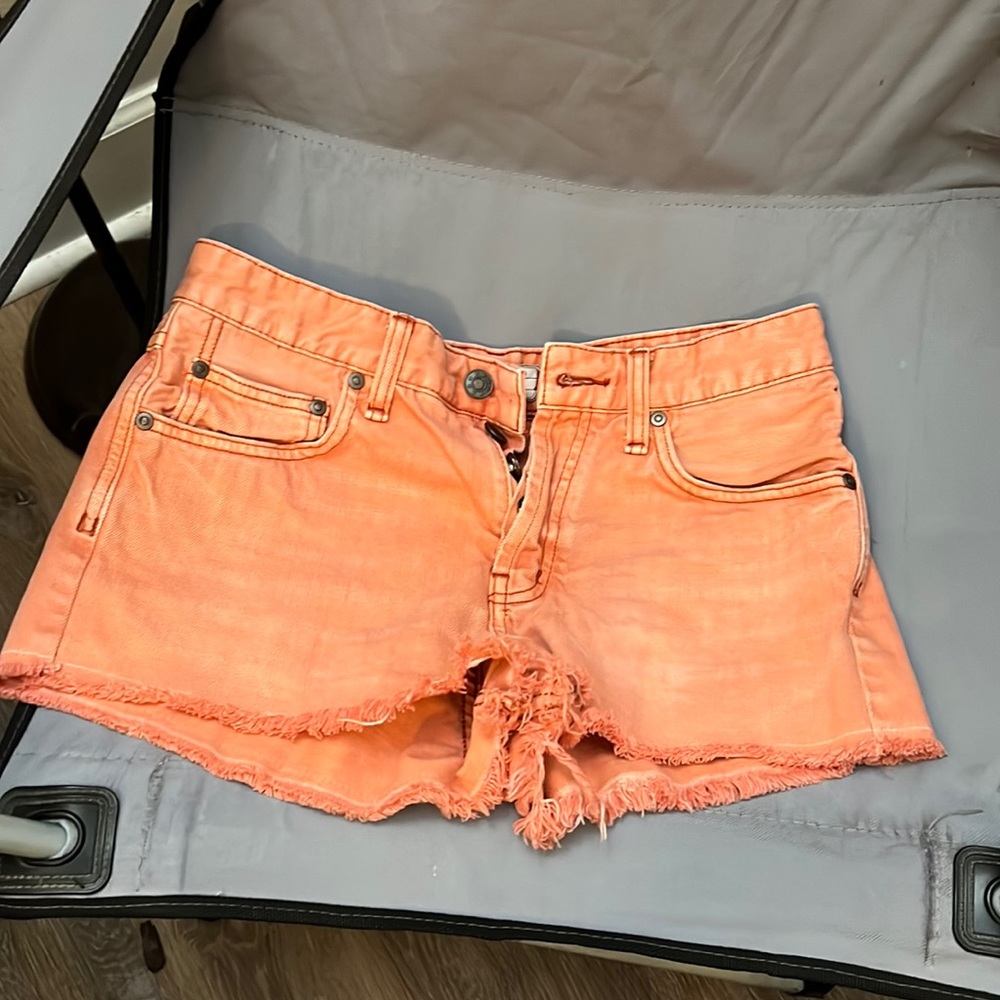 I am selling women coral/peach shorts size 27